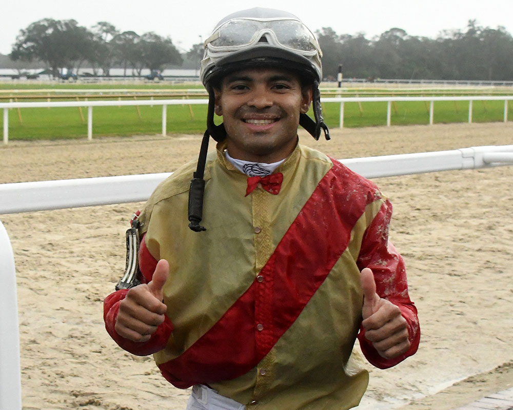 Jockey Luis Saez celebrates Litigate's victory in the G3 Sam F. Davis Stakes at Tampa Bay Downs. Litigate is a part of the Elmont, LLC thoroughbred racing partnership.