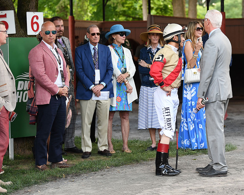 Members of the Centennial Farms Thoroughbred racing partnership that owns Belmont Stakes runner Antiquarian on Belmont Stakes Day at Saratoga Race Course with John Velazquez and Todd Pletcher.